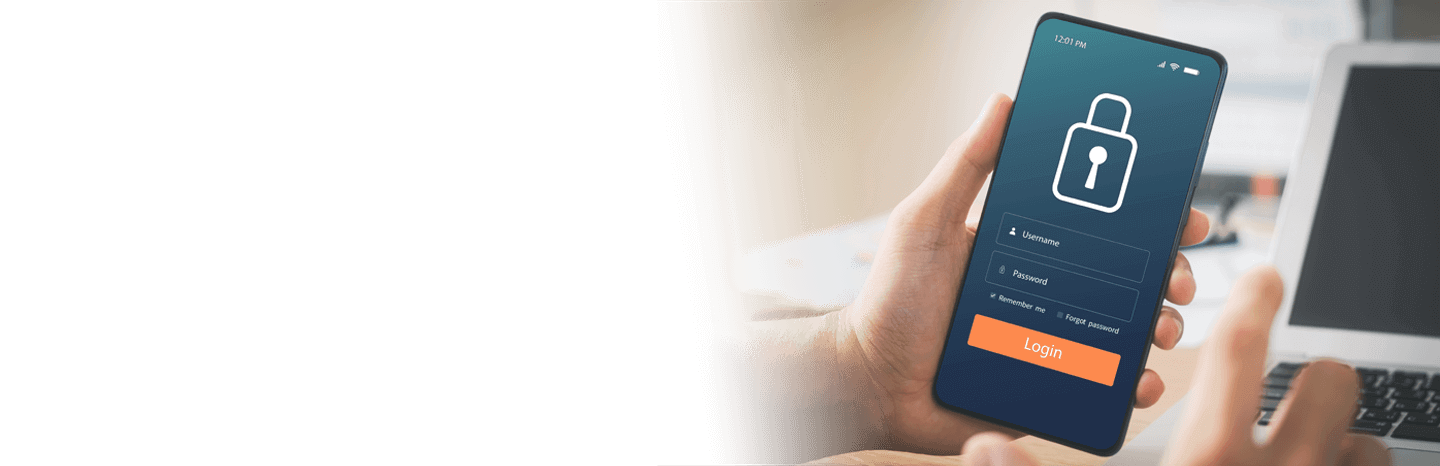 Person holding a mobile device with a padlock requesting a username and password