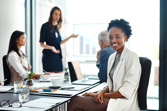Young woman sitting at table in an office
