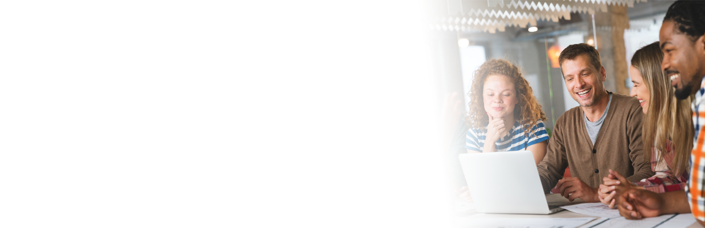 Four students going over a project together on a laptop