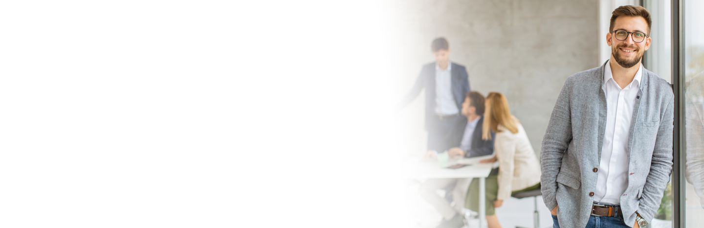 Young man smiling in an office