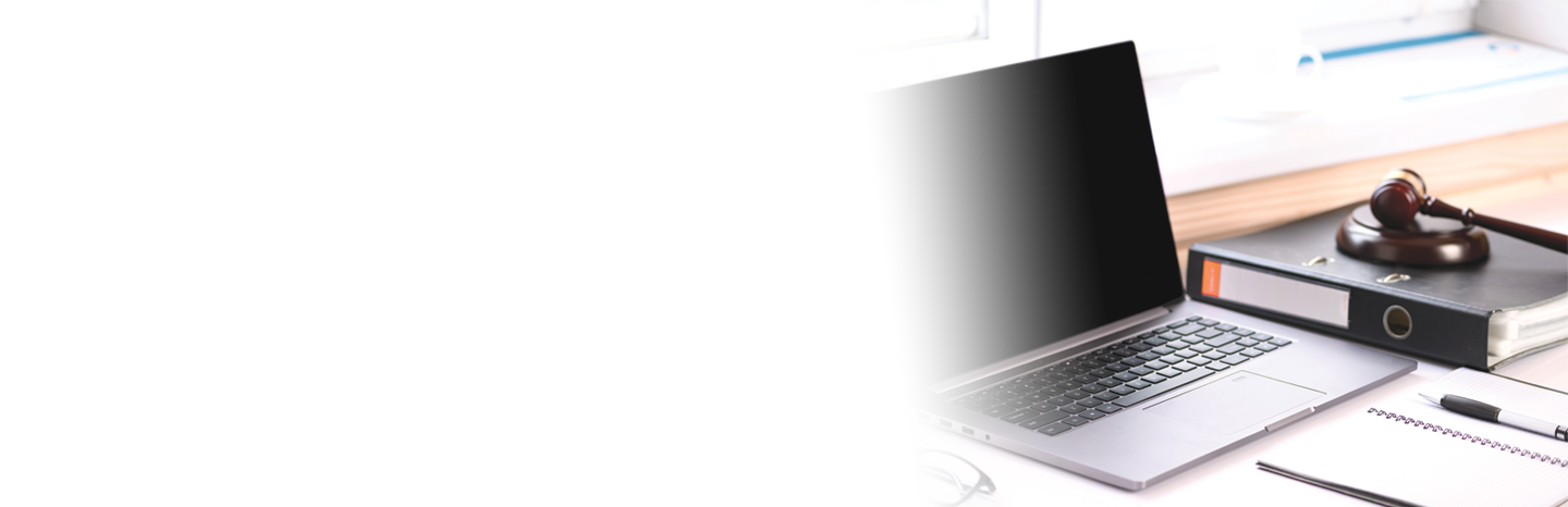 Jurisprudence courses. On the table there is a computer and a folder with business papers. Online learning