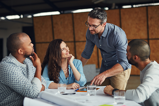 People, small business and meeting with tablet for help, advice or project management in office. Team, leader or architecture with tech for positivity feedback or planning for company growth.