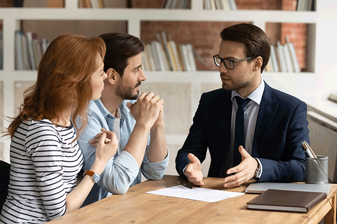 Lawyer consulting with a couple in an office